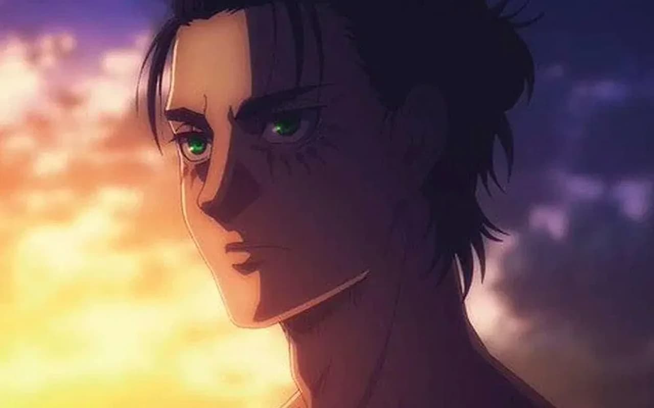 Eren Yeager en una escena de la temporada final del anime, mirando hacia el horizonte.