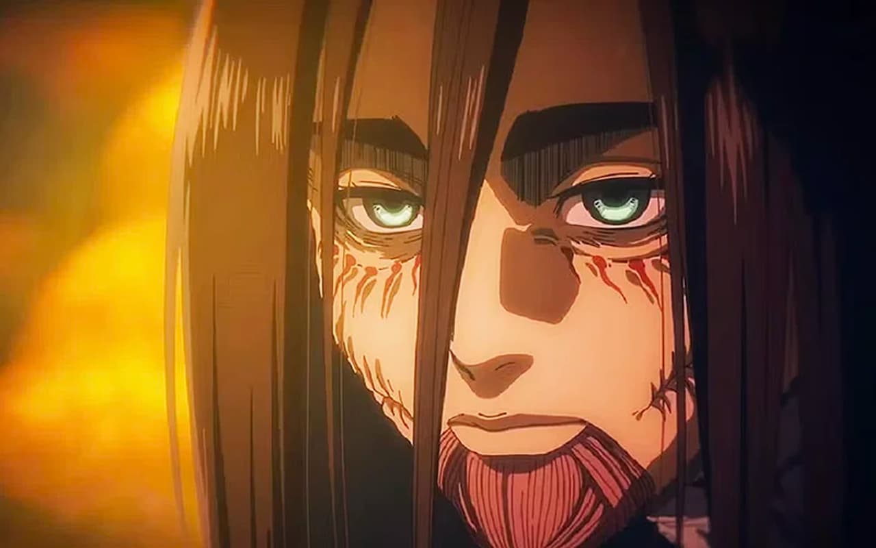 Eren en Attack on Titan Final Season THE FINAL CHAPTERS Special 2, con la mirada intensa y marcas de titán en el rostro.